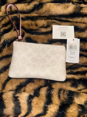 COACH Signature Pebble Zip Wristlet in Blush Pink and Cream